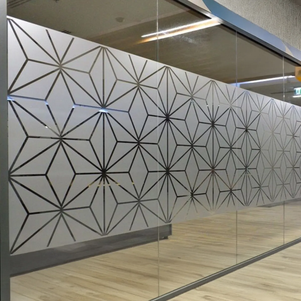 Large glass doors with a decorative diamond frosted pattern