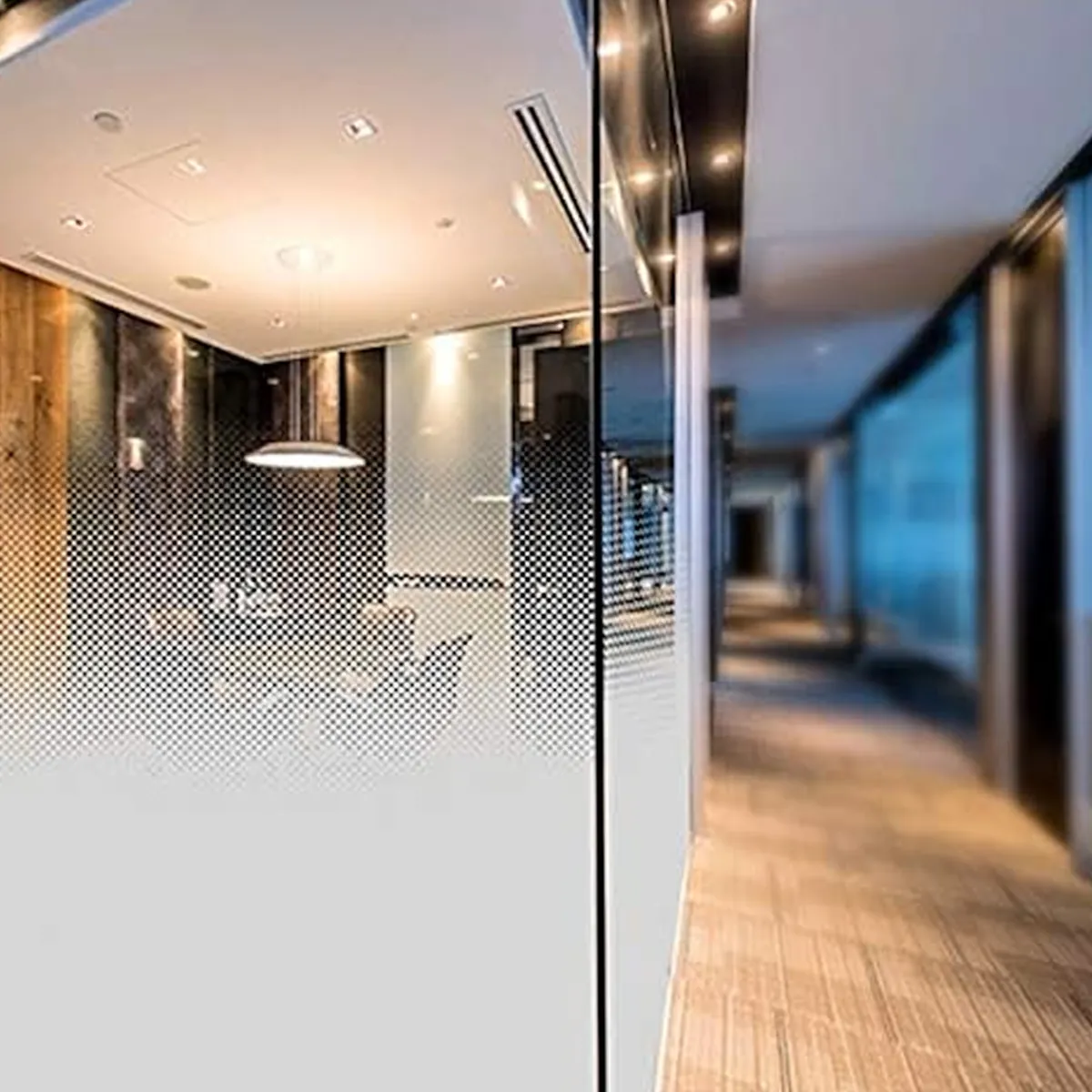 Executive glass wall with clear-to-frosted gradient film